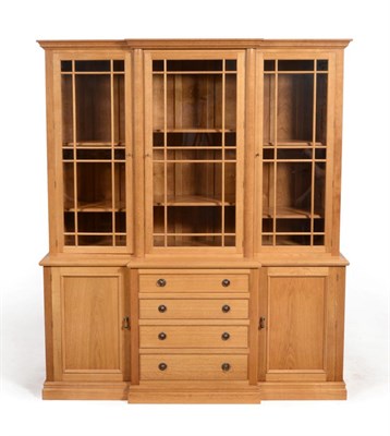 Lot 693 - A Michael  "Seahorse " Riley Panelled Oak Breakfront Bookcase, with glazed upper section above...