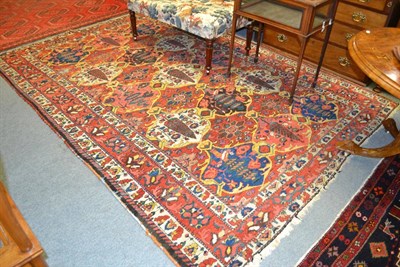 Lot 1239 - Bakhtiari carpet, West Persia, the madder lattice field of stylised trees, plants and birds...