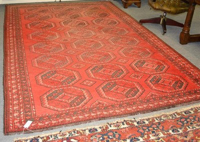 Lot 1240 - Ersai carpet, Northern Afghanistan, the crimson field with three columns of elephant foot guls...