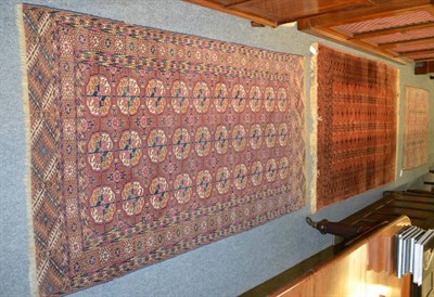 Lot 1245 - Tekke rug, Emirate of Bukhara, the madder field with three columns of quartered guls enclosed...