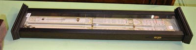 Lot 1256 - A reproduction Admiral Fitzroy barometer in ebonised glazed case, 27cm by 99cm