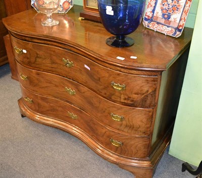 Lot 1264 - Serpentine three drawer chest