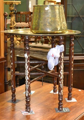 Lot 1275 - A middle eastern brass work tray top table with a bone inlaid stand and a similar jardiniere