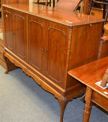 Lot 1281 - A walnut cocktail cabinet