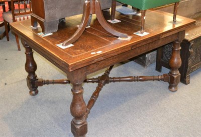 Lot 1289 - An oak draw leaf dining table and a mahogany reading stand (a.f.)