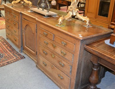 Lot 1291 - A wide 18th century oak dresser base with two banks of two short over three long drawers flanking a