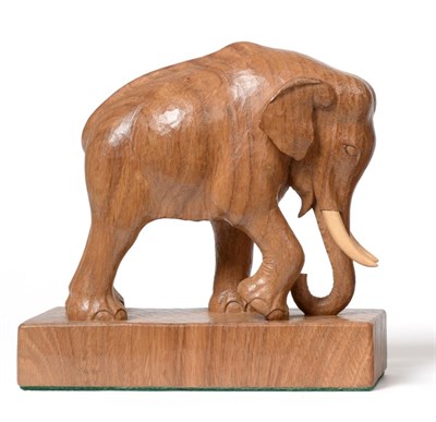 Lot 700 - Stan  "Woodpecker " Dodds (1928-2012): A Carved Oak Elephant Model, mounted on a wooden plinth...