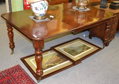 Lot 1303 - A mahogany pull out dining table with extra leaf