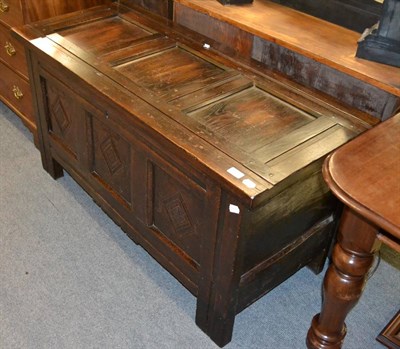 Lot 1305 - An oak three panelled coffer