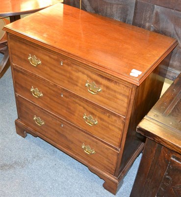 Lot 1306 - A reproduction mahogany three drawer dressing chest