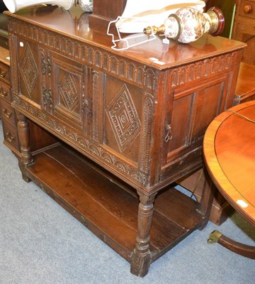 Lot 1308 - A 17th century style oak food cupboard