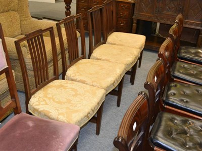 Lot 1313 - A Harlequin set of four mahogany dining chairs with fluted splats and shaped seats raised on square