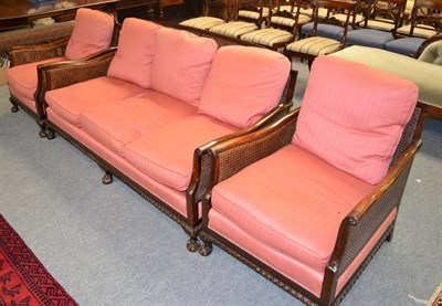 Lot 1318 - Three piece double-caned bergere suite