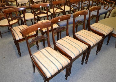 Lot 1320 - A set of six George IV mahogany bar back dining chairs with drop-in seats and fluted legs