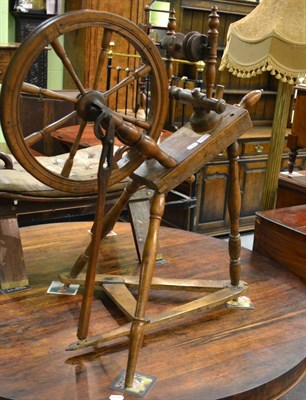 Lot 1345 - A fruitwood spinning wheel