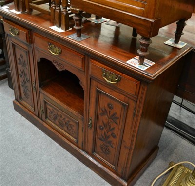 Lot 1349 - An Art Nouveau sideboard with brass handles (with key)