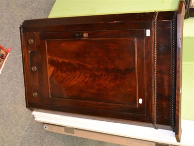 Lot 1365 - A well figured George III mahogany corner cupboard