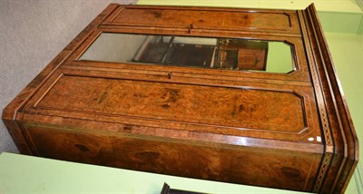 Lot 1366 - A good Victorian figured walnut three door wardrobe, the central door with a bevelled mirror...