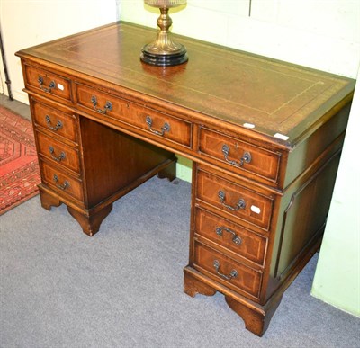 Lot 1371 - A reproduction mahogany pedestal desk