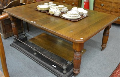 Lot 1372 - A 20th century oak wind-out dining table with two leaves