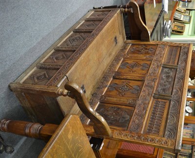 Lot 1374 - An 18th century and later oak high back settle with hinged panel seat