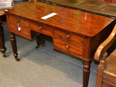 Lot 1375 - A William IV mahogany kneehole writing table, 2nd quarter 19th century, with five frieze...