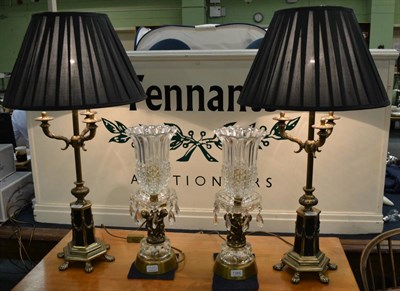 Lot 1386 - A pair of black and brass candelabra lamps