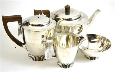 Lot 321A - A George VI silver four piece tea service, Wakely & Wheeler, London 1943, comprising hot water...