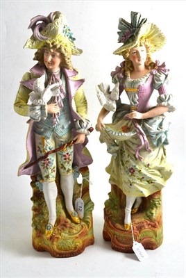 Lot 12 - A pair of late 19th century German biscuit porcelain figures of a lady and gallant
