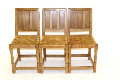 Lot 714 - A Set of Three Sid Pollard Panel Back Oak Dining Chairs, lattice leather seats on octagonal...