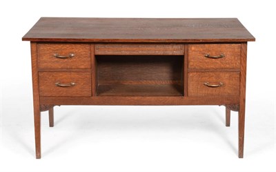 Lot 715 - An Arts & Crafts Arthur Simpson of Kendal Oak Desk, the rectangular top over a hinged frieze...