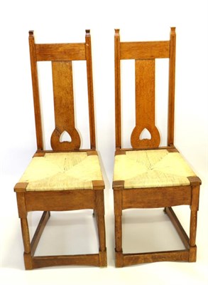 Lot 719 - Attributed to Wylie & Lochhead: A Pair of Arts & Crafts Oak Chairs, each with slanted splats...