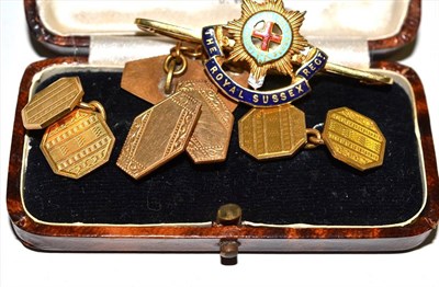 Lot 90 - A pair of 18ct gold cufflinks, a regimental brooch and a pair of rolled gold cufflinks
