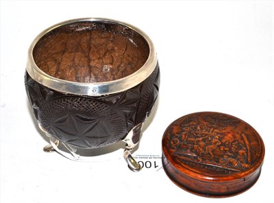 Lot 100 - A French pressed burrwood snuffbox, 19th century, of circular form, the cover with FETE...