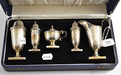 Lot 105 - A cased silver cruet and a cream and caster by Viners of Sheffield