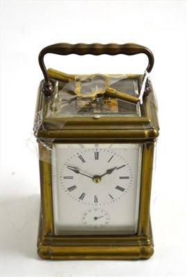 Lot 108 - A brass striking alarm carriage clock