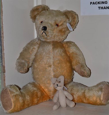 Lot 125 - A gold plush teddy bear and a smaller bear