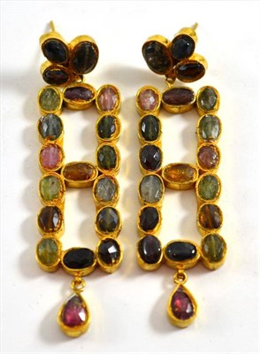 Lot 133 - A pair of tourmaline earrings, the long oblong shaped drops inset with tourmalines of different...