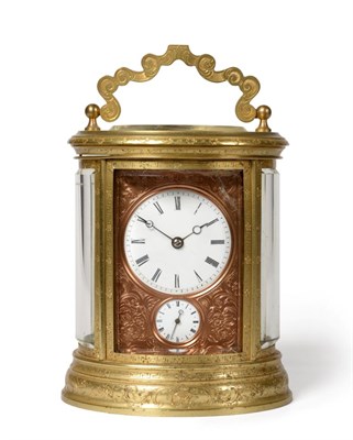 Lot 725 - An Oval Brass Engraved Striking Alarm Carriage Clock with the Trademark JS mark for J.Soldano...