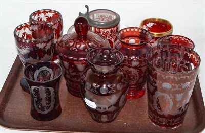 Lot 180 - Assorted red bohemian glass including vases, lidded tankard with pewter mounts, vase and cover,...