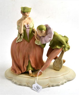 Lot 182 - Royal Dux figure modelled as a lady and a man playing a mandolin, 30cm high