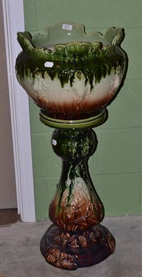 Lot 227 - Late Victorian Bretby style pottery jardiniere and stand