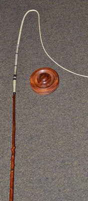 Lot 229 - A modern holly driving whip with wall mounted holder