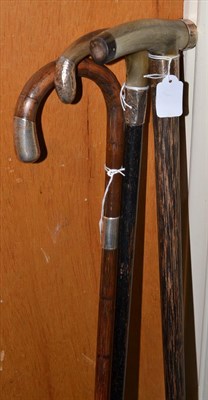 Lot 232 - Two horn handled silver mounted walking sticks and one other (3)