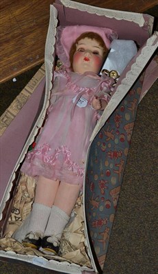 Lot 246 - Circa 1930's German Tessie doll in a pink dress and bonnet with original clothing, fabric...