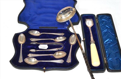 Lot 254 - A cased silver cheese scoop, cased silver teaspoons, a pair of sugar tongs and a ladle