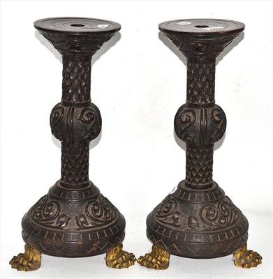 Lot 256 - Pair of carved candle stands