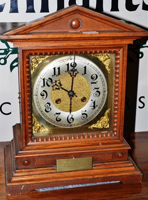 Lot 263 - Oak cased mantel clock with brass dial and presentation plaque dated 1908