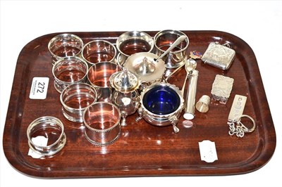 Lot 272 - Assorted silver napkin rings, silver three piece condiment set, vesta, vinaigrette, ingot etc