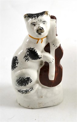 Lot 332 - A rare Staffordshire cat with double bass